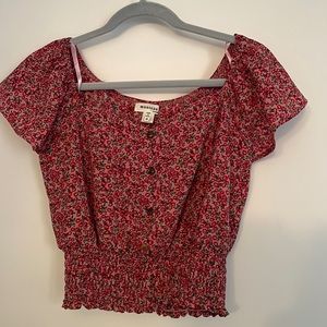 This is a woman’s cropped T-shirt size medium.